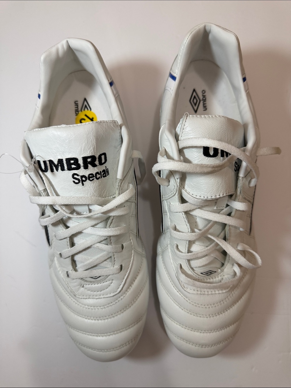 Umbro White Athletic Sneakers with Blue Accents
